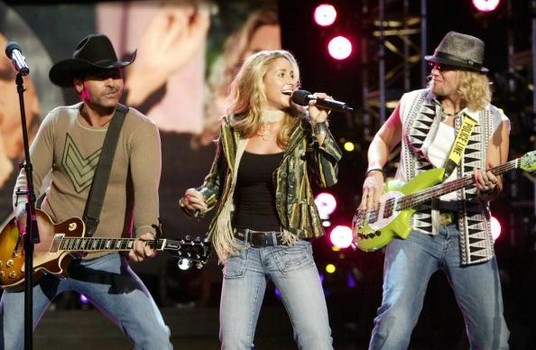 LOS ANGELES - SEPTEMBER 5: Trick Pony Keith Burns, Heidi Newfield and Ira Dean perform on stage at the Jerry Lewis MDA Telethon on September 5, 2004 in Los Angeles, California. (Photo by Frazer Harrison/Getty Images)